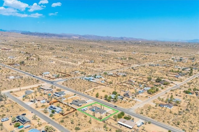 drone / aerial view featuring a mountain view