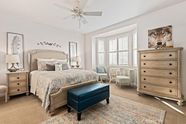 bedroom with ceiling fan and carpet floors