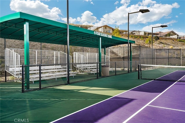 surrounding community with tennis court