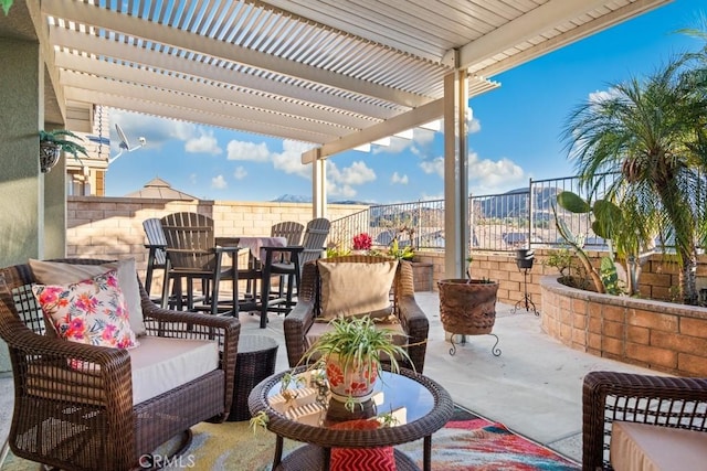 view of patio / terrace with an outdoor living space and a pergola