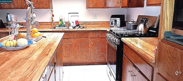 kitchen featuring butcher block counters and electric range