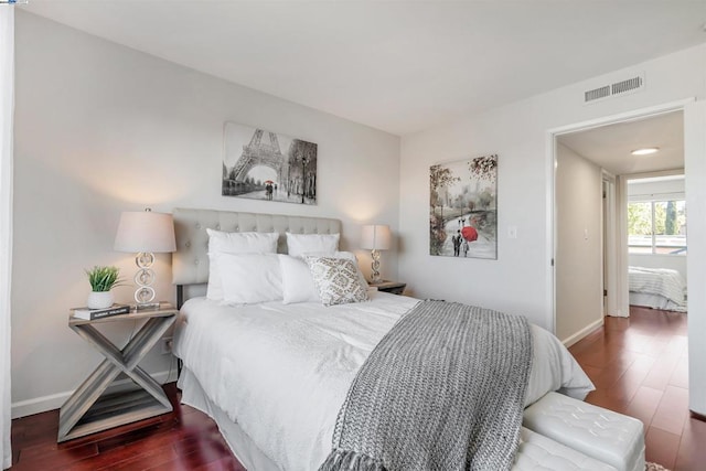 bedroom featuring dark hardwood / wood-style flooring