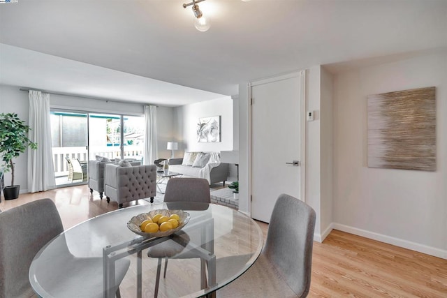 dining room with light wood-type flooring