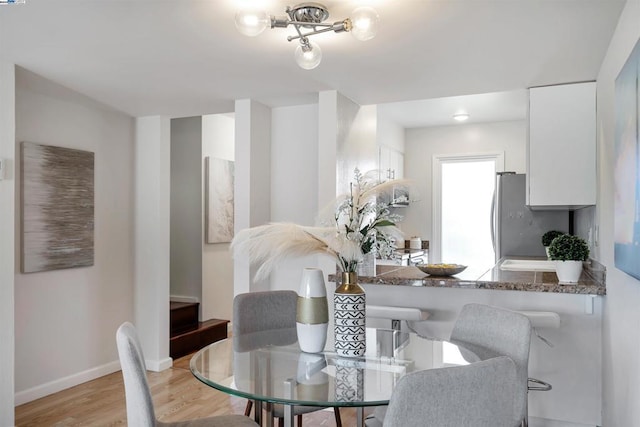 dining space featuring light hardwood / wood-style flooring