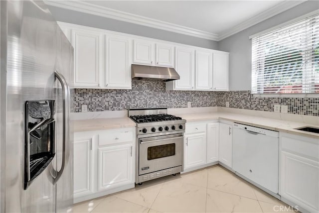 kitchen featuring backsplash, stainless steel appliances, ornamental molding, white cabinets, and light stone counters