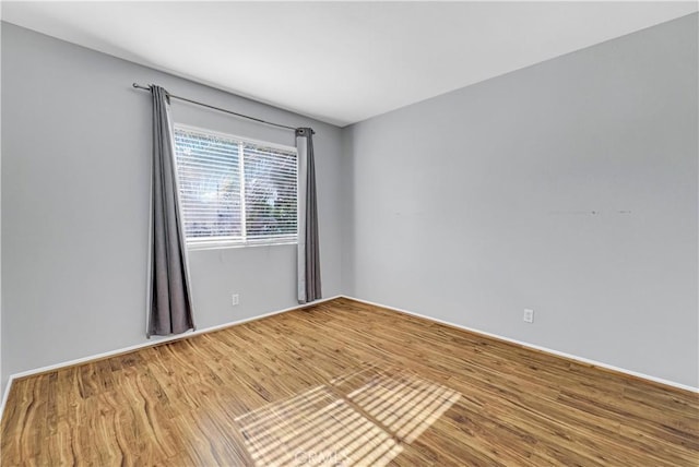 spare room featuring hardwood / wood-style flooring