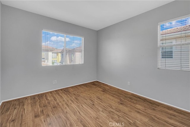 empty room featuring wood-type flooring