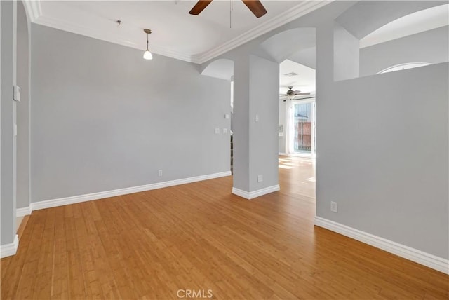 unfurnished room with light wood-type flooring and ornamental molding