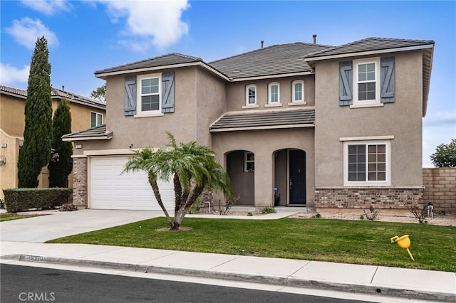 view of front of home featuring a garage and a front lawn