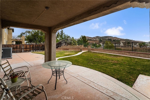 view of patio / terrace featuring a mountain view