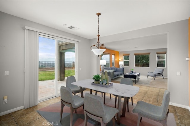 dining area with tile patterned flooring