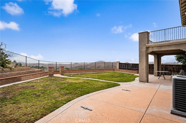 view of yard with a patio area and central air condition unit