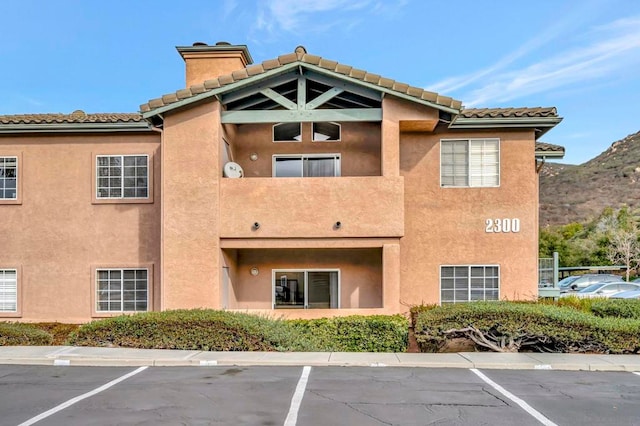 view of building exterior featuring a mountain view