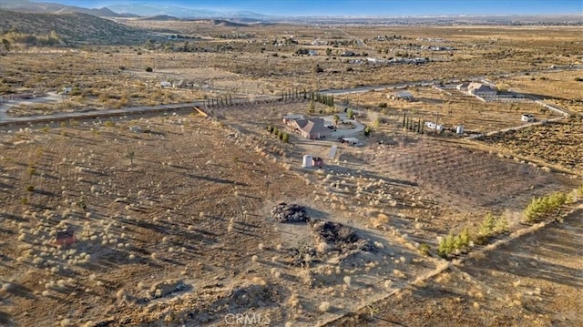 aerial view featuring a rural view and a mountain view