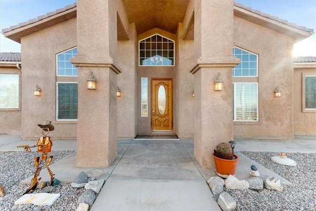 doorway to property with a patio area