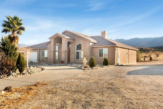 view of front of home with a mountain view