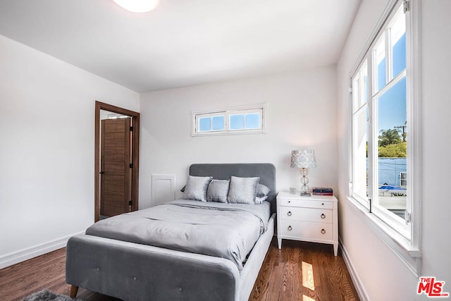 bedroom featuring dark wood-type flooring