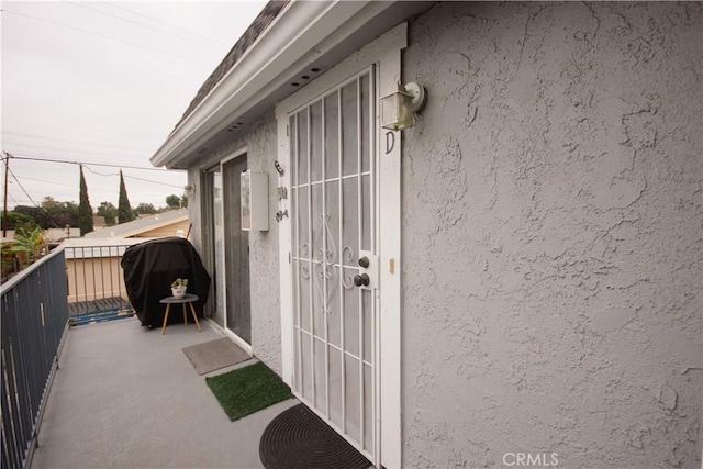 property entrance with a balcony