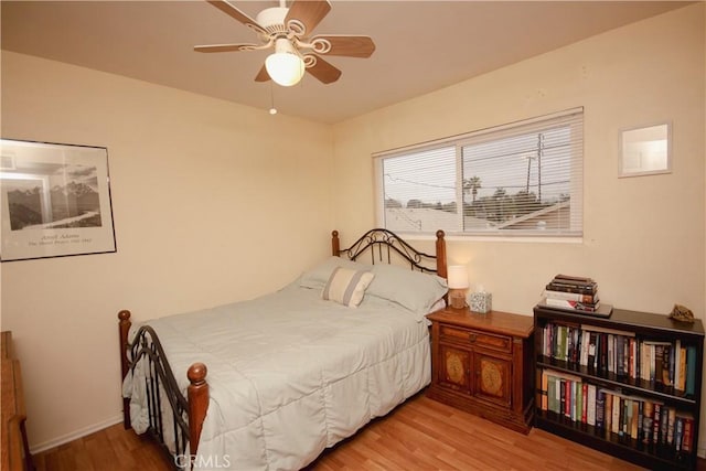 bedroom with ceiling fan and light wood-type flooring