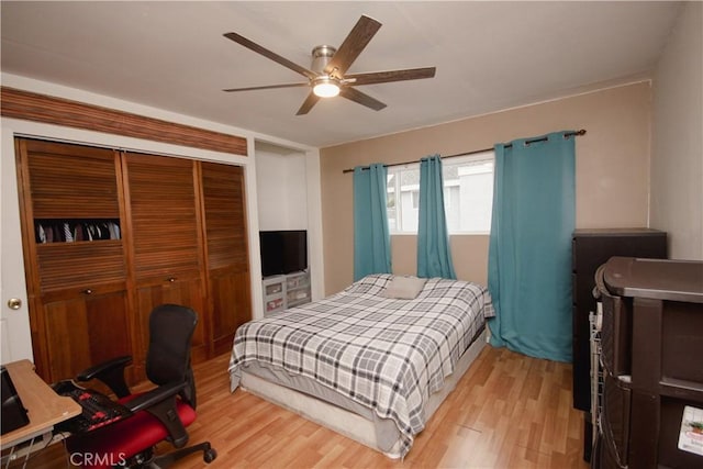 bedroom with ceiling fan, a closet, and light hardwood / wood-style flooring