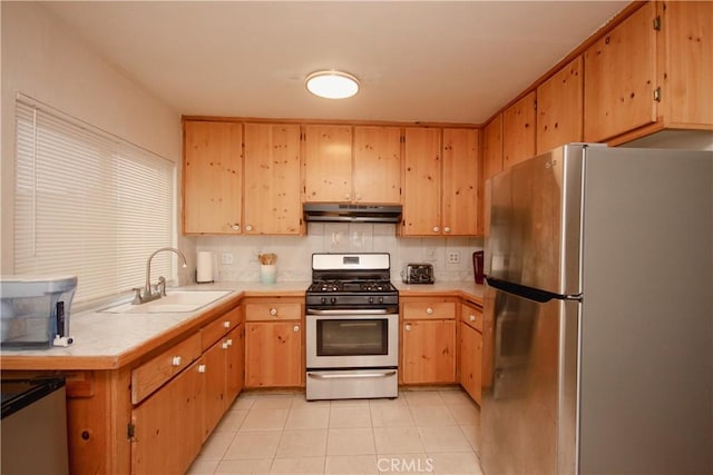 kitchen with stainless steel appliances, decorative backsplash, sink, tile countertops, and light tile patterned flooring