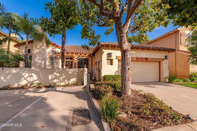 mediterranean / spanish-style home featuring a garage