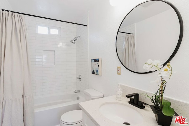 full bathroom with toilet, vanity, and shower / bathtub combination with curtain