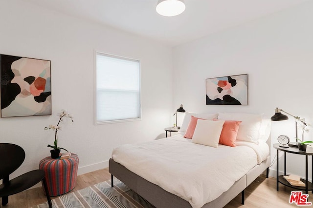 bedroom with light wood-type flooring