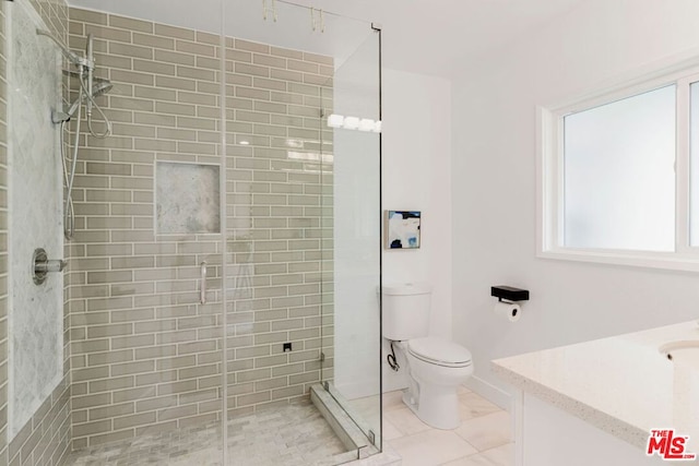 bathroom featuring walk in shower, tile patterned floors, vanity, and toilet