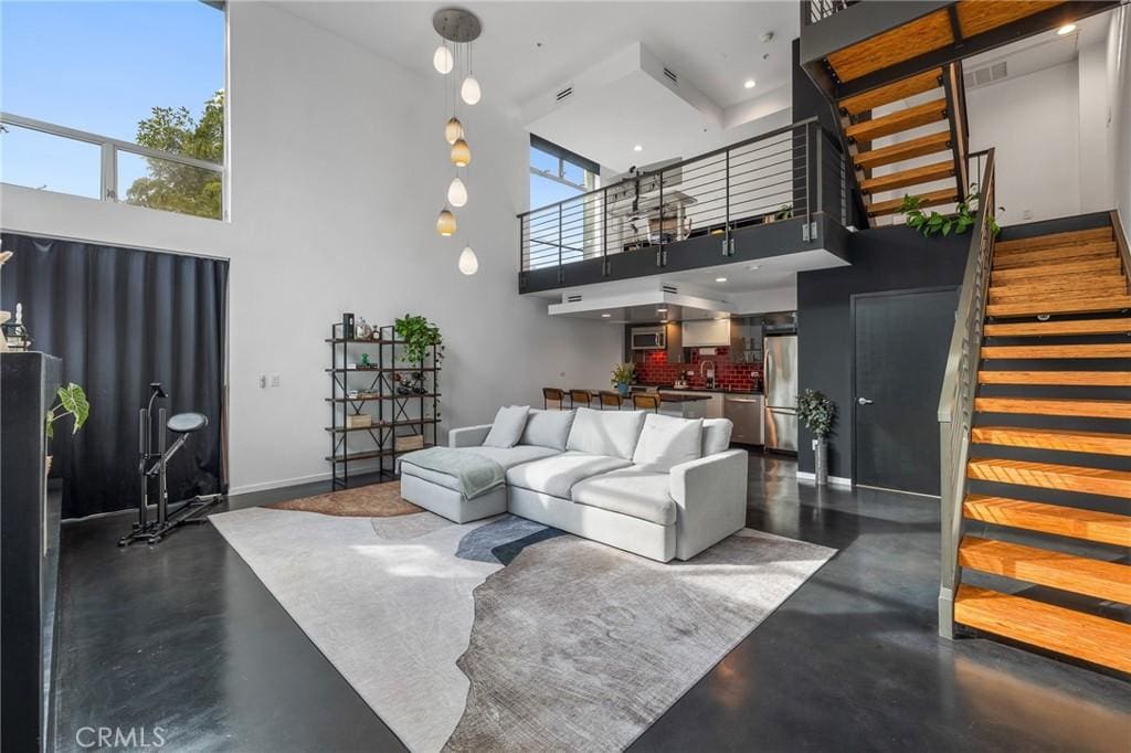 living room with a towering ceiling