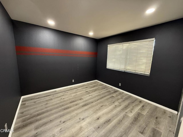 unfurnished room featuring hardwood / wood-style floors