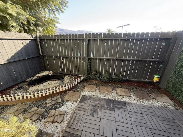 view of patio / terrace featuring a mountain view