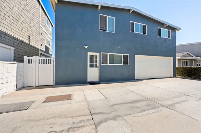 view of side of home featuring a garage