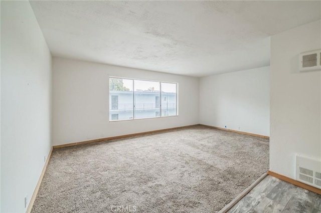 unfurnished room with carpet