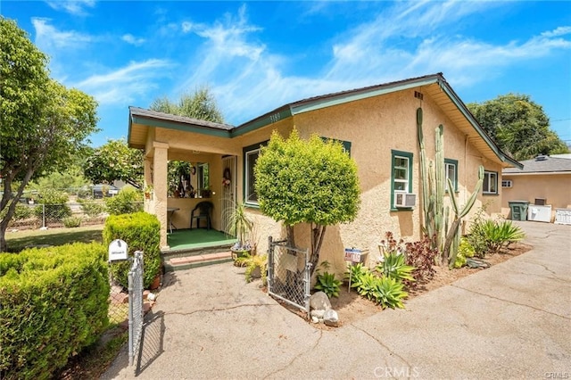 view of front of home featuring cooling unit