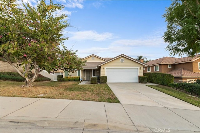 single story home with a garage and a front lawn