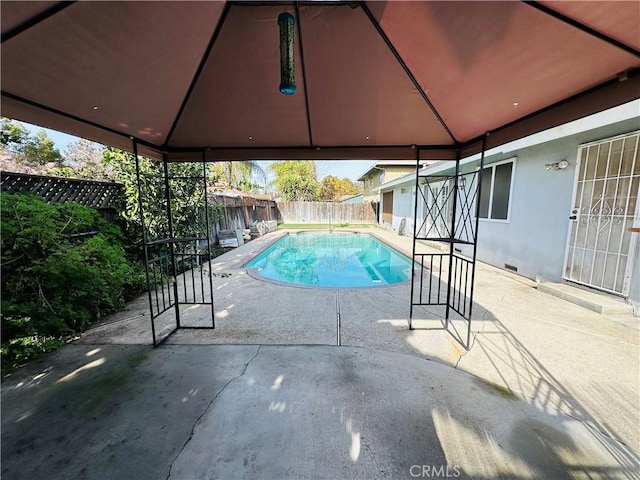 view of swimming pool with a gazebo and a patio area