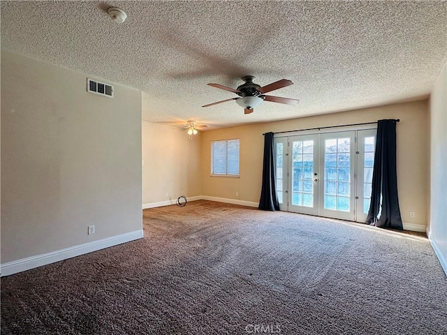 unfurnished room featuring ceiling fan, carpet, a textured ceiling, and french doors