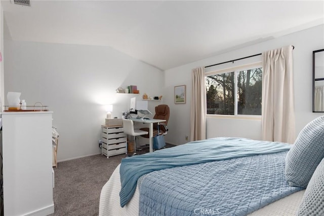 carpeted bedroom with vaulted ceiling