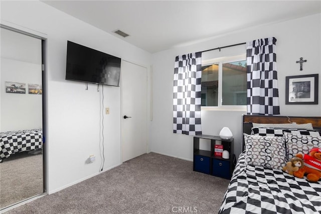 bedroom featuring a closet and carpet