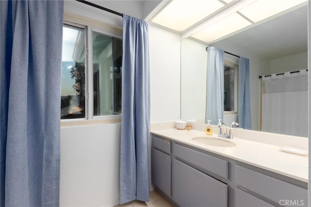 bathroom with tile patterned flooring and vanity