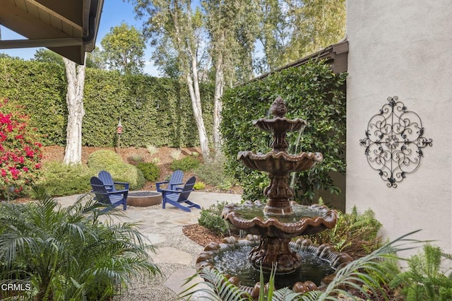 view of patio / terrace with a fire pit