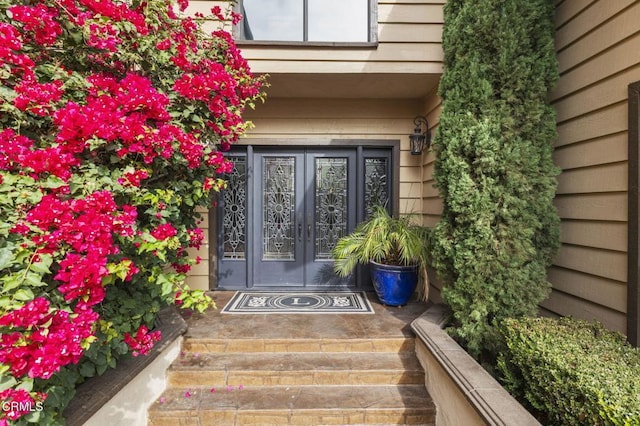 property entrance featuring french doors