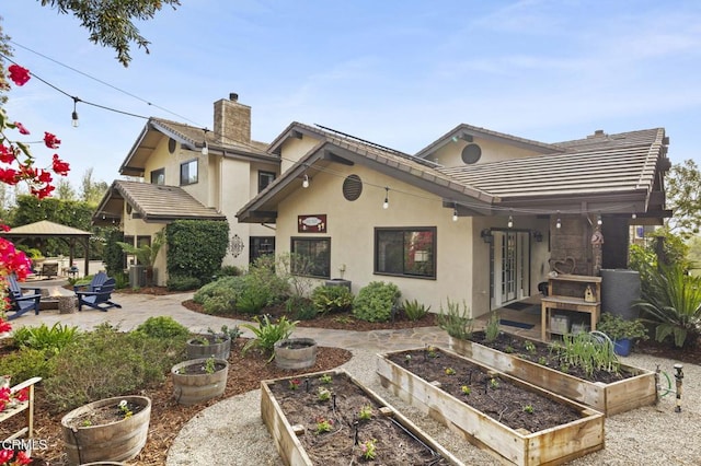 back of house with a patio area, a gazebo, and french doors