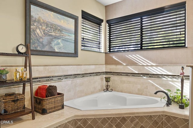 bathroom featuring a relaxing tiled tub