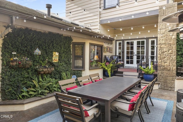 view of patio / terrace featuring french doors and outdoor dining space