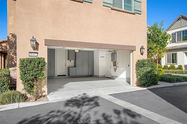 view of exterior entry featuring a garage