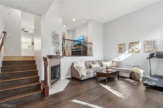 living room featuring dark hardwood / wood-style floors and a fireplace