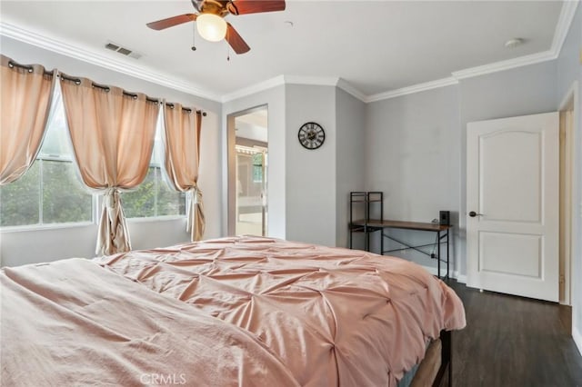 bedroom featuring ceiling fan, crown molding, dark hardwood / wood-style floors, and ensuite bath