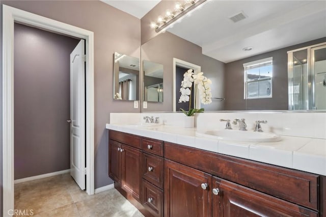 bathroom with vanity and tile patterned floors